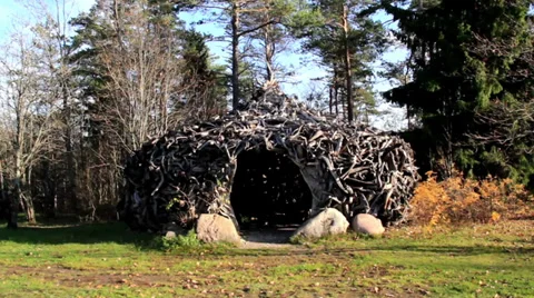 Witch house hut found in the middle of trees and some rocks Stock Footage 32538129