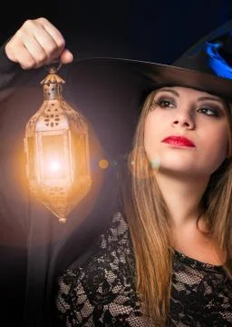 Witch with lantern Stock Photos