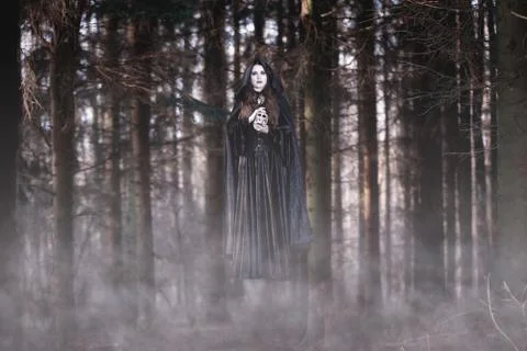 Witch levitating in the forest Stock Photos
