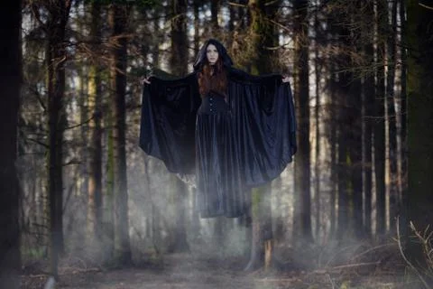 Witch levitating in the forest Stock Photos