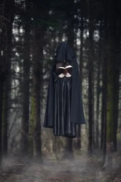 Witch levitating in the forest Stock Photos