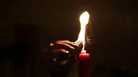 The witch lights a red candle in the dark Stock Footage 104700202