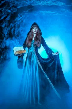 The witch with magic ball in her hands causes a spirits Stock Photos