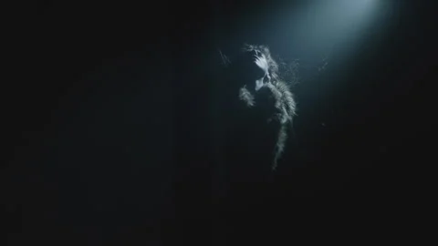 A witch performing a ritual dance under the spotlight Vídeo Stock 259859919