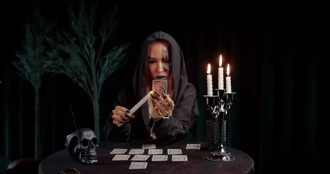 Witch picking tarot card from magical layout Stock Footage 319601914
