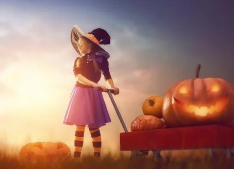Witch with pumpkins Stock Photos