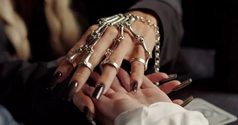 Witch reading client palm in mystical ritual Stock Footage 320007544