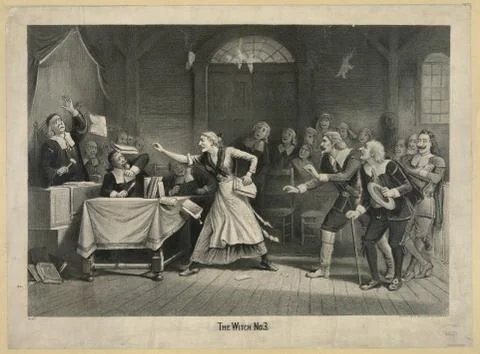 A witch refuting accusations at her trial. Foto stock