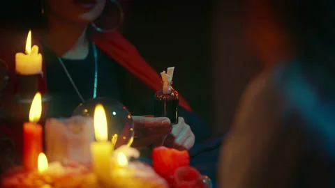Witch selling potion to client, bewitching someone, wizarding world, witchcraft Stock Footage 170818060