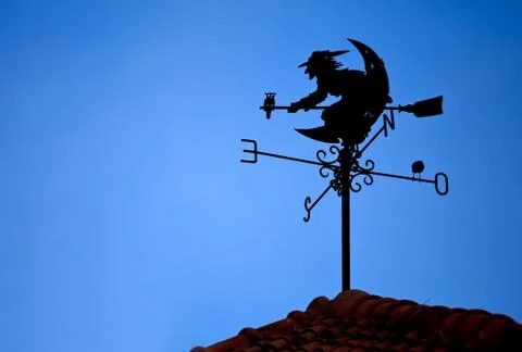 Witch shape on weather vane Stock Photos