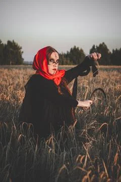 Witch with sickle Stock Photos