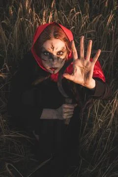 Witch with sickle Stock Photos