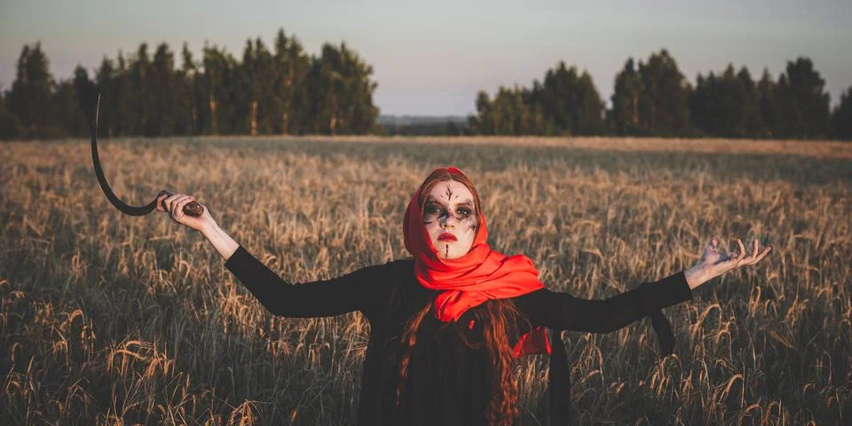 Witch with sickle Stock Photos