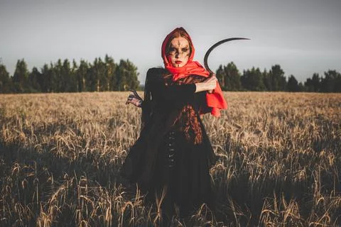 Witch with sickle Stock Photos