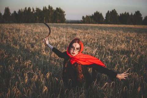 Witch with sickle Stock Photos