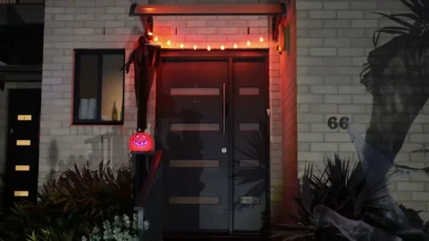 Witch, spiders, pumpkin skull with lights around Halloween in dark – 4k. Stock Footage 164072112