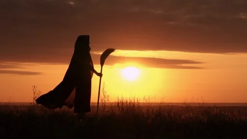Witch standing on the mountain landscape at sunrise Stock Footage 112500528