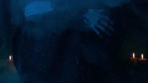 Witch stroking jack-o-lantern. Scary smoke. Mystical light. Halloween. Stock Footage 141857463