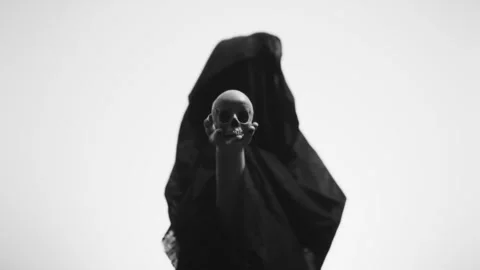 A witch in veil holding a Skull Stock Footage 259003113