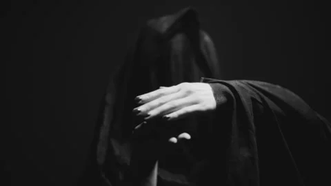 A witch in veil holding something in her hands Video stock 259002011