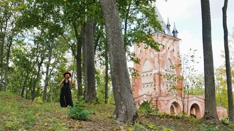 Witch walks through the forest halloween  mystic  horror celebration 스톡 동영상 116120364