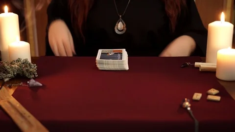 A witch wonders using tarot cards on table. Magical ritual. Divination concept. Stock Footage 108011855