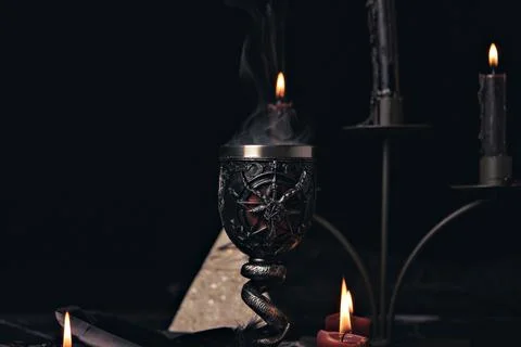 Witchcraft composition with candles, magic book and pentagram symbol. Altar f Stock Photos