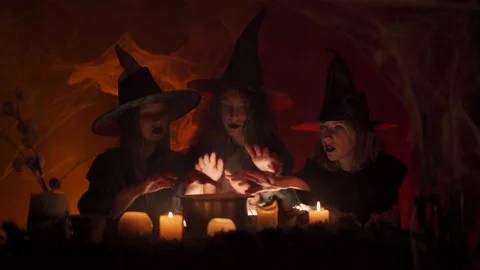 Witches are conjuring over the cauldron, casting spells. Halloween horror. 스톡 동영상 163388274