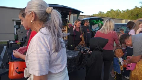 Witches Hand Out Candy at School Trunk-Or-Treat Stock Footage 318103463