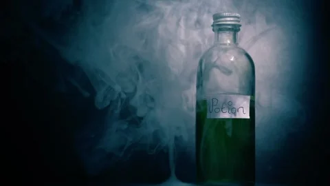 Witches potion in a bottle with smoke close up shot 스톡 동영상 309033446