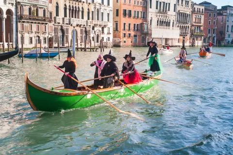 Witches Rowing at Regatta of Befana in Venice Stock Photos