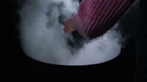 Witch's big boiling cauldron with chicken Stock Footage 191003777