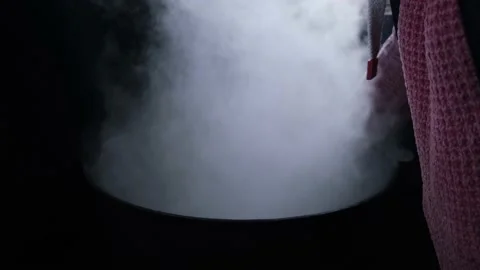 Witch's big boiling cauldron with chicken Stock Footage 191005439