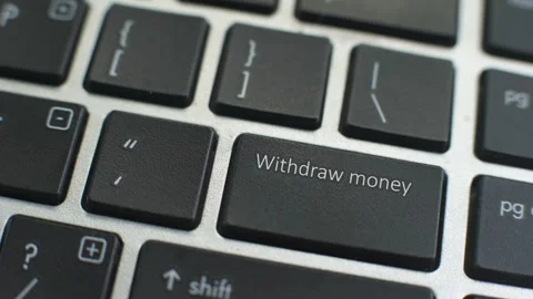 Withdraw Money button on computer keyboard, female hand fingers press key Stock Footage 97828722