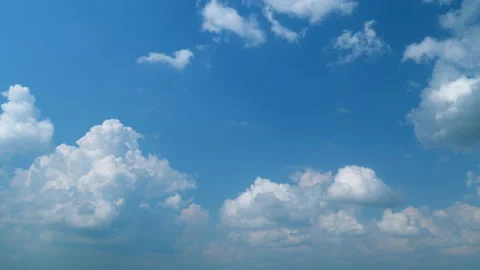 Withe clouds in a blue sky. White fluffy cumulonimbus clouds forming before Stock Footage 209594852