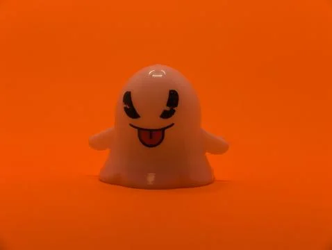 Withe gost  - orange backgroud Stock Photos