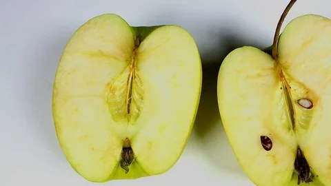 Withered old rotten apples next to running hourglass Stock Footage 105007158