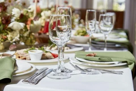 Within the elegant chamber, a finely set table showcases a harmonious blend of Stock Photos