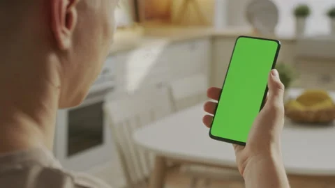 Without Touching or Swiping. Back View of Man Holding Chroma Key Green Screen Stock Footage 197380739