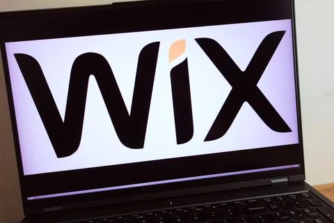 WIX software company logo displayed on laptop Stock Photos