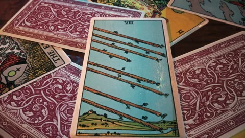 Wizard casting a spell on Eight of Wands car foreseeing positive life change Stock Footage 250782573