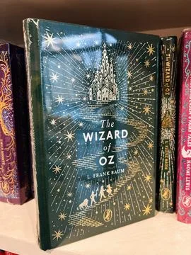 The Wizard of Oz by L. Frank Baum on a starry blue cover shelf display Stock Photos
