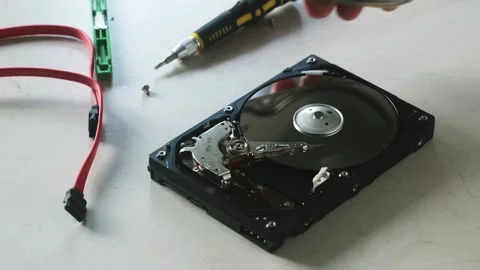 The wizard removes the cover of the old broken hard drive. Stock Footage 248525937