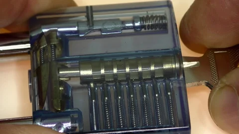 The wizard shows how a transparent padlock works. Video stock 122570687