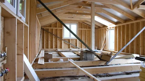 Woden log cabin house under construction for off grid lifestyle immerse in Stock Footage 172003272