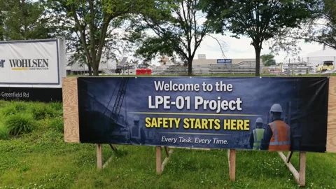 Wohlsen Construction sign and LPE-01 Project safety banner mark entrance of Stock Footage 336696770