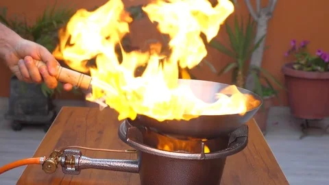 Wok on fire during cooking beef in outdoors in slow motion Stock Footage 83940484