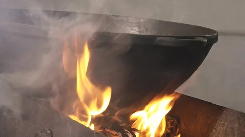 Wok with flame from barbecue Stock Footage 117363480