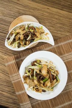 Wok fried eel with leeks and aromatics Stock Photos