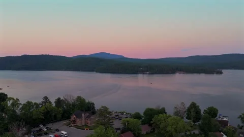 WOL The Island harbor view ferry Ponton boats dock lodging cars Lake Schroon Stock Footage 340964521
